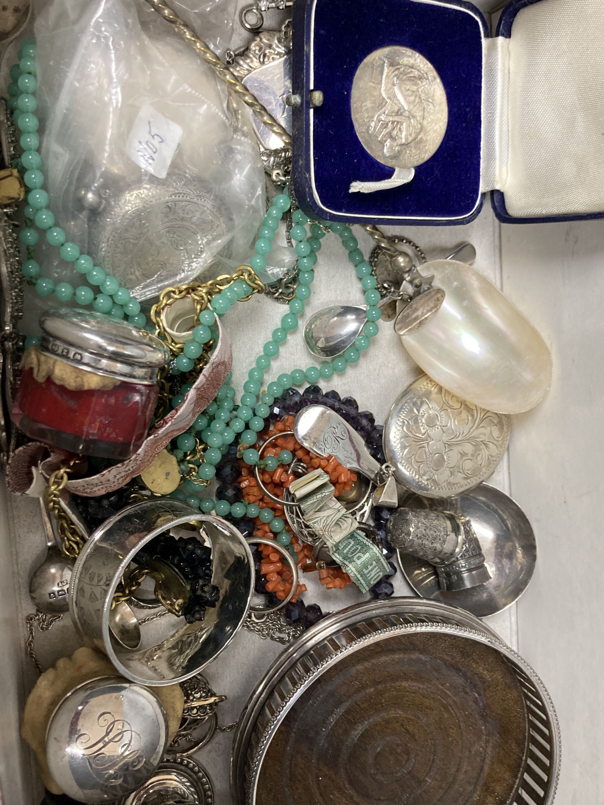 A quantity of silver, including wine labels and assorted costume jewellery.